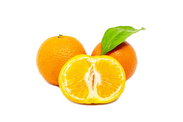 Group of whole and cut mandarines with green leafs on white background