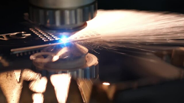 Modern technologies production high-tech equipment. CNC Laser cutting of metal, metallic hot gas in computer heavy industry. Industrial manufacture machine. Metalworking at plant. Cut metal laser burn