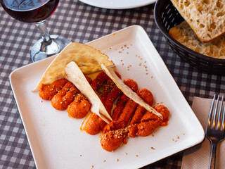Muhamara - delicious cream made on the basis of hot pepper and walnuts with spices with Arabic bread
