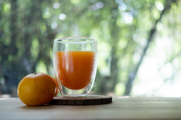 Fresh orange juice glass in glass and fresh orange fruit.