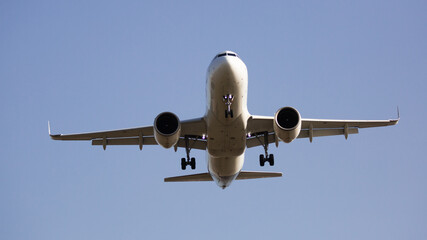 Fototapeta premium Image of passenger plane landing in airport afternoon at sunny day