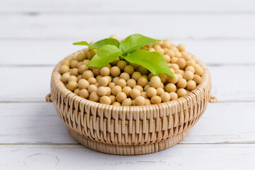 Soybean or soya bean in a bowl on white table background, healthy concept.