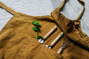 Gardener apron with garden tools for growing home garden and vegetable garden. . High quality photo