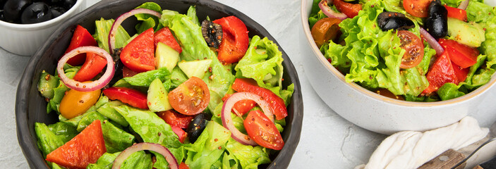 Fresh vegetables salad on light gray background. Healthy eating concept.