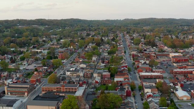 Descending Aerial Of Colorful Historic Small Town In USA. Columbia Pennsylvania, Lancaster County Buildings In City, Spring Season Shot.