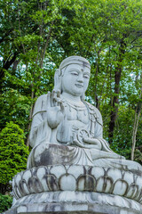 Seated Buddha on lotus flower plinth