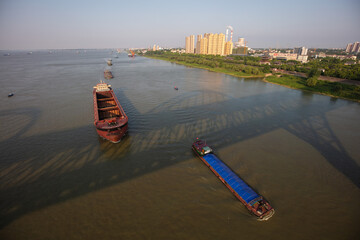 Jiujiang, China - May 9, 2021: A view of the Yangtze River in the middle and lower reaches of China is full of cargo ships. Chinese shipping has recovered to the level before the COVID-19 outbreak.
