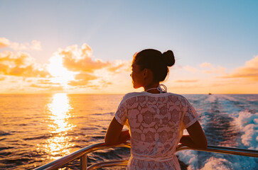 Cruise ship vacation woman watching sunset boat deck on summer travel. Silhouette of tourist...