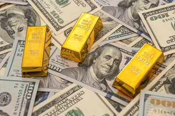 large bank gold bars bullions on dollars bills