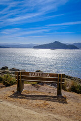 Naklejka na ściany i meble Wooden bench with the name of the place where it is located, on the beach of Samieira in the Rias Baixas, Galicia (Spain)