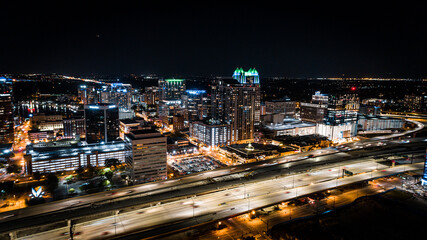 Fototapeta na wymiar Aerial cityscape of downtown Orlando at night with the 408 expressway in the foreground.