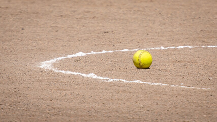 Yellow Softball in Pitching Circle on Dirt