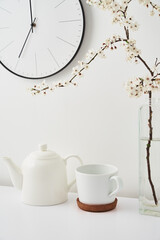 Fototapeta na wymiar Teapot and cup on the table