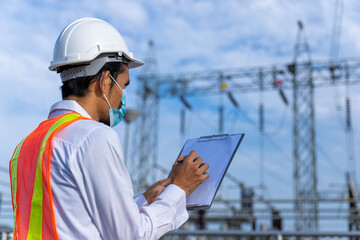 A young engineer recorded the report. Daily inspection at the main power station