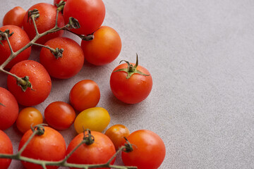 Fresh red variety of tomatoes with basil spices, pepper. Tomato vegetable concept. Vegan diet food. Harvesting tomatoes. Fresh tomato used for cooking.Top view.
