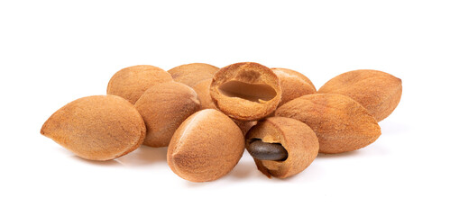 velvet tamarind fruit ( Dialium cochinchinense) isolated on white