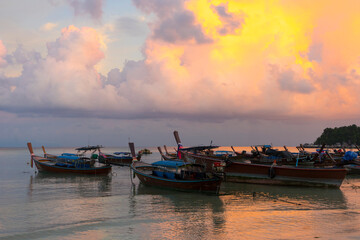 Longtail boats harbor at Ko Lipe island in evening light in Satun, Thailand.