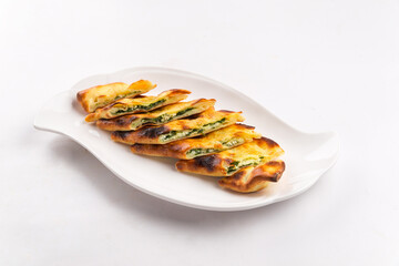 Isolated plate of sliced calzone Italian folded pizza