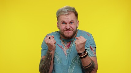 Upset frustrated annoyed stylish guy 30s years old raising hands in indignant expression,...