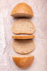 Wholemeal bread . On a light background. Top view. The concept of healthy eating.