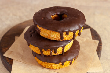 Cupcakes with chocolate frosting on craft paper. Close up.