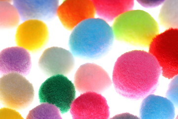 Closeup colorful Pompom in white background