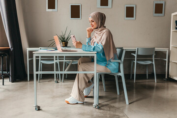 modern muslim woman in hijab in office room