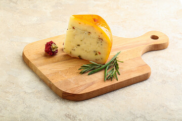 Hard cheese with dry tomato