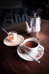 Relaxing in an old coffee shop with a cup of coffee.