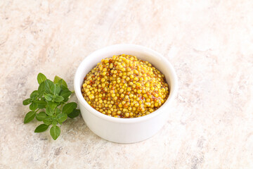 Grain mustard sauce in the bowl