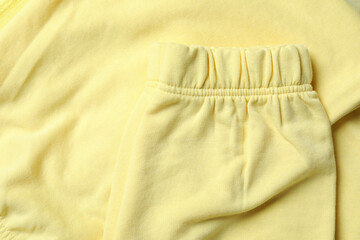 Yellow sweatshirt on whole background, close up