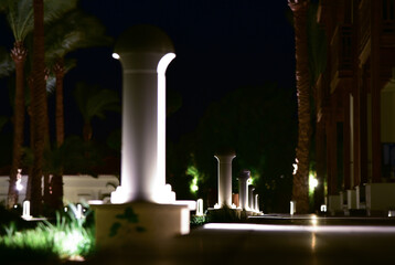 Lighting lanterns along the terrace at night