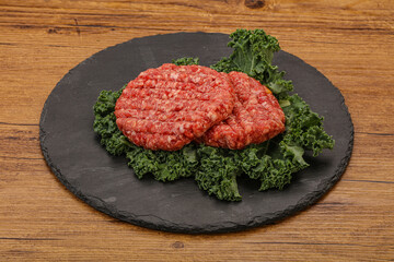 Raw beef burger cutlet for cooking