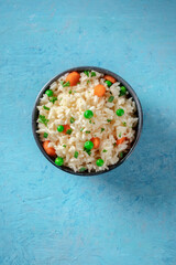 Vegan rice, top shot on a blue background