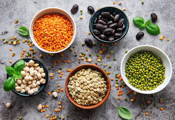 Bowls with different types of legumes