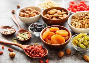 Bowls with various dried fruits and nuts