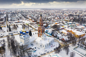 Winter drone view of Bronnitsy cityscape with orthodox Cathedral of the Archangel Michael, Russia
