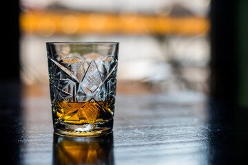 Whisky glass on a wooden surface