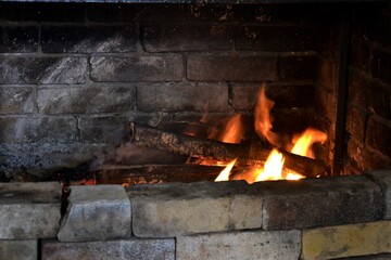 Fire, wood and a wall in a Winter day