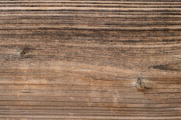 Rustic wooden plank in dark natural colour with texture