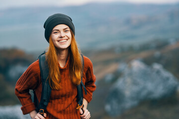 woman hiker with backpack smile landscape mountains travel