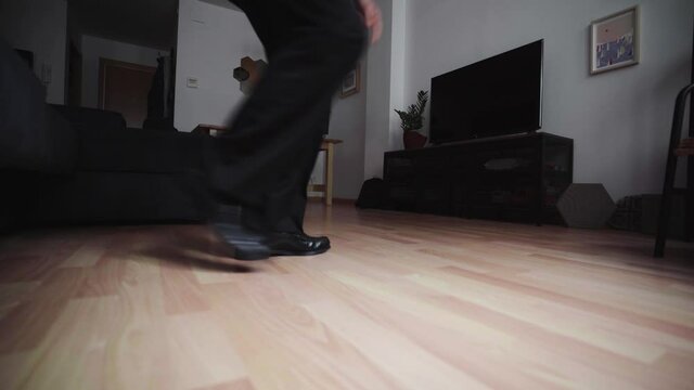 Happy hispanic corporate employee celebrating a raise dancing