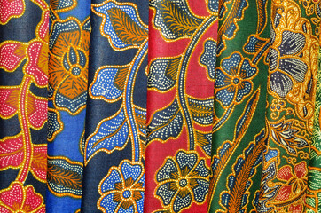Balinese batik sarong are readily available at art markets, shops or tourist attractions / Batik Sarong background / Beautiful and affordable, simple to tie, easily matched to your wardrobe 