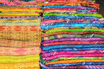 Obraz premium Balinese batik sarong are readily available at art markets, shops or tourist attractions / Batik Sarong background / Beautiful and affordable, simple to tie, easily matched to your wardrobe 