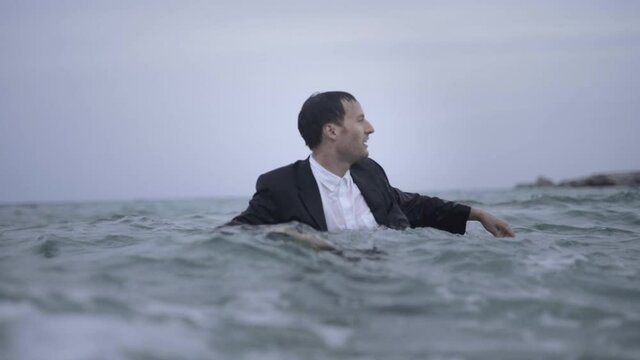 Finally free from shackles of society feeling freedom in ocean