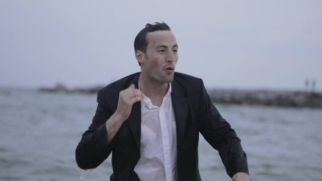 Rejuvenating swim wearing suit rising in slow motion 