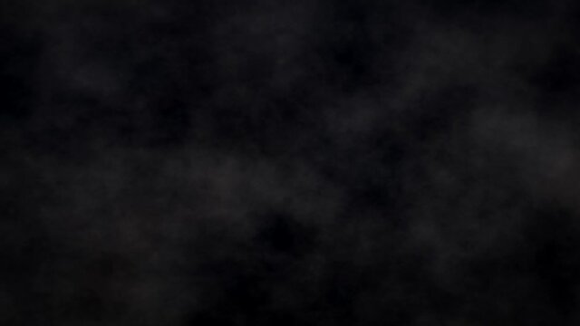 Atmospheric smoke Fog dust effect. VFX Element. Abstract smoke cloud slow motion on black background. White smoke slowly floating through space against black background.