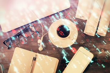 Multi exposure of data drawing hologram over topview of study desk background with computer. Concept of technology.