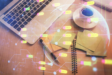 Double exposure of data theme drawing hologram over topview work table background with computer....