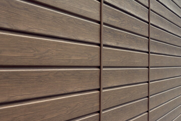 brown wooden wall with horizontal stripes.